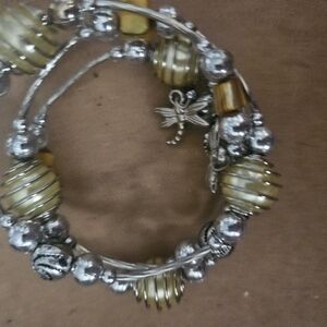 silver and yellow beaded bracelet with dragonfly charm